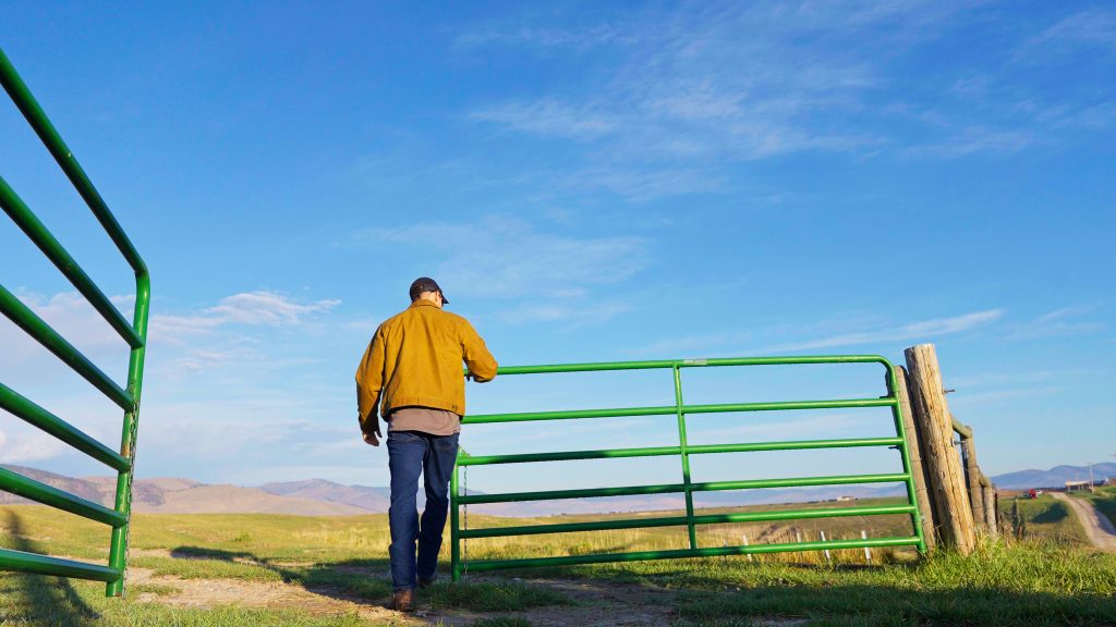 land agent opening a gate